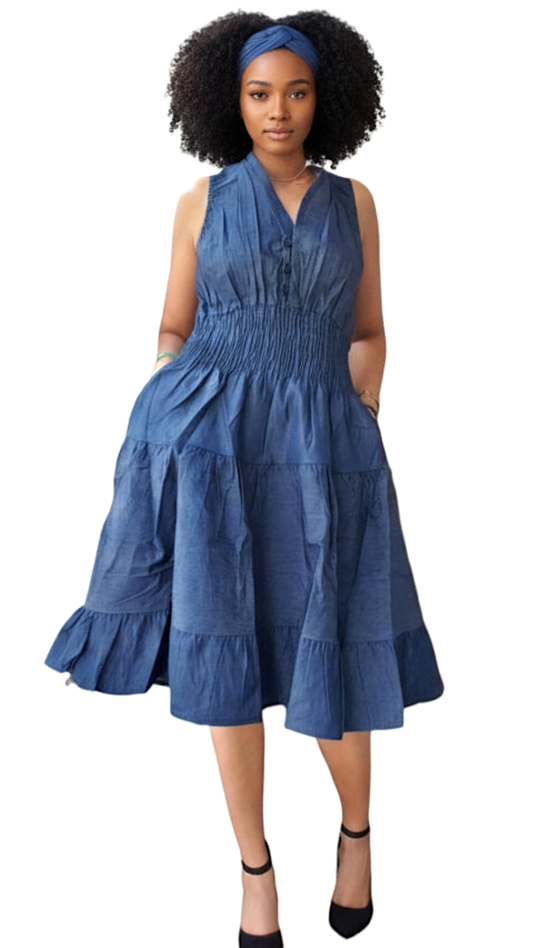Woman wearing a blue dress with a white background